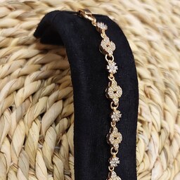 دستبند جواهری زنانه مجلسی پرنگین طلایی ، مشابه طلا ، استیل رنگ ثابت