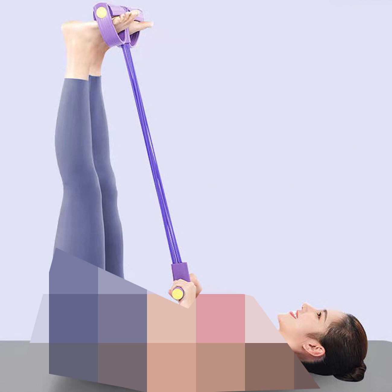 Woman using a purple resistance band with foot pedals while lying on her back, demonstrating a leg exercise.