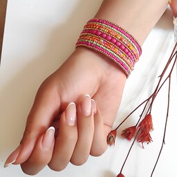 دستبند هندی دستبند رنگی رنگی دستبند شیک دستبند مهره ای دستبند صورتی بدلیجات به قیمت عمده