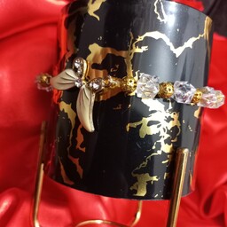 دستبند مرواریدی طرح پروانه دستبند سنگ رنگ شفاف و طلایی ارسال فوری