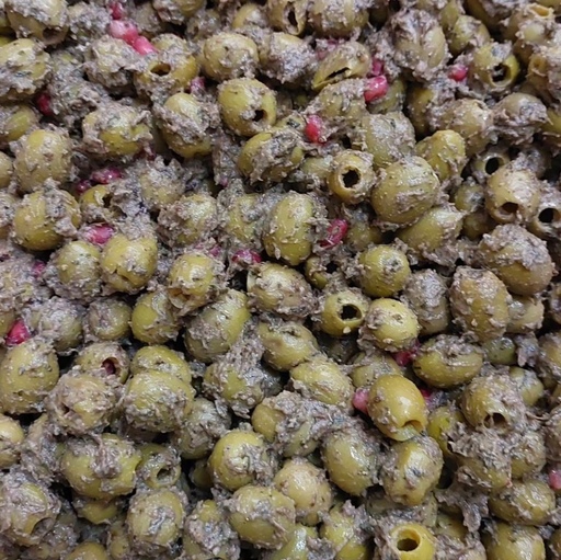 زیتون پرورده خونگی پرملاط در بسته بندی های یک کیلویی به همراه دون انار ترش و آب انار محلی