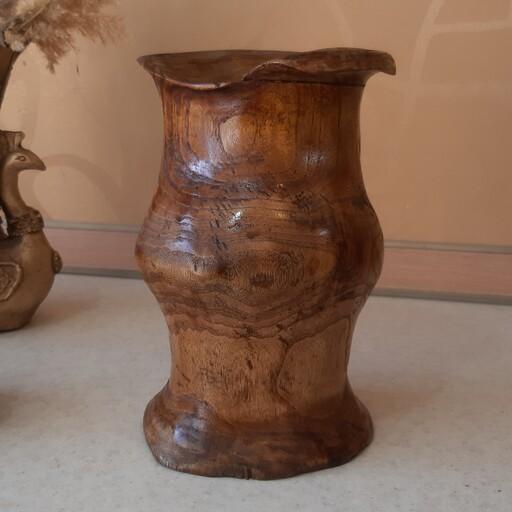 گلدان چوبی دفرمه  جذاب با تراش دست از چوب زیتون باکیفیت