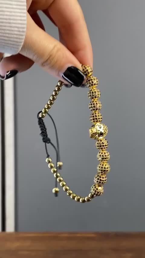 دستبند اسکلتی نگین دار مدل Gold Skulls کد Stdt-419d1