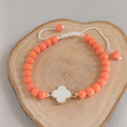 دستبند زنانه و دخترانه کریستالی نارنجی با خرجکار شبدر سفید