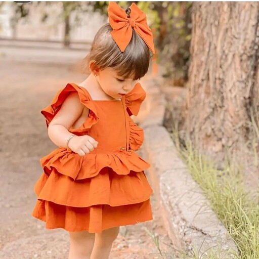   پیراهن چین دار لنین فشن دخترانه بچگانه رنگ کرم و نارنجی مناسب یک تا هفت سال