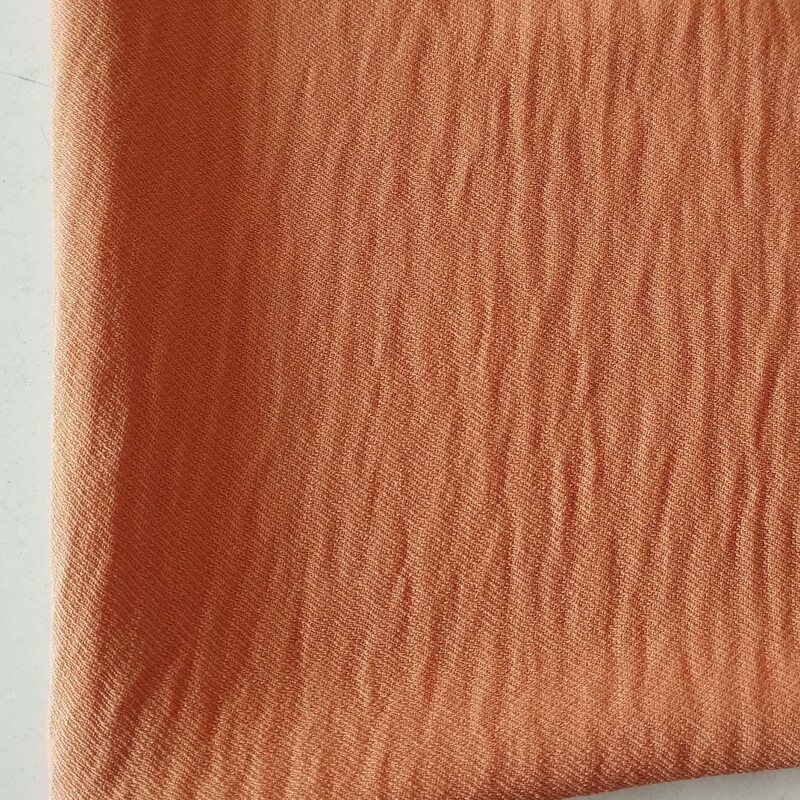 پارچه ی بنتون ابروبادی جنس خوب عرض 150 درجه ی یک تک رنگ رنگ نارنجی 