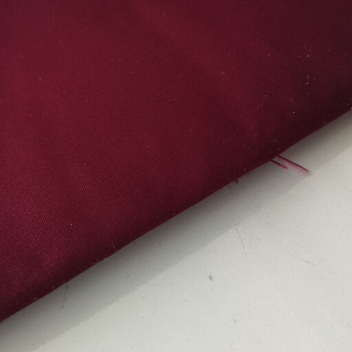 پارچه ی ساتن آمریکایی عرض 150 جنس خوب تک رنگ رنگ زرشکی قیمت به ازای نیم متر 