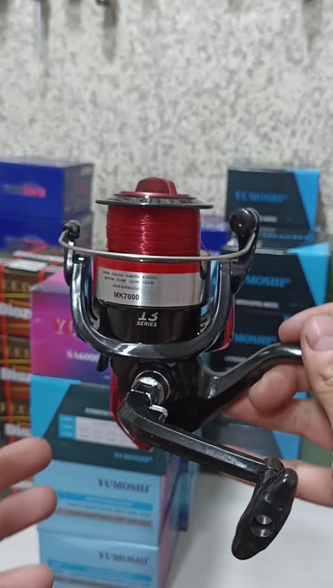 چرخ ماهیگیری 7000 برند یوموشی به همراه نخ مدل MK7000 مناسب برای چوب ماهیگیری لنسر ماهیگیری
