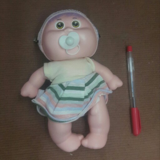 عروسک نوزادی دست با پیچش دارد قد22 سانتی
