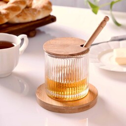 عسل خوری شیشه ای درب چوبی همراه با قاشق چوبی
