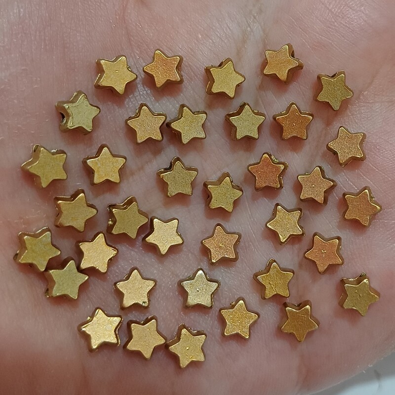 مهره طرح ستاره طلایی دوسوراخ دار  (پک 30عددی) سایز 6 بین مهره ای 