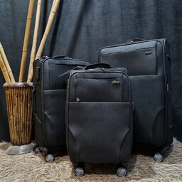چمدان اوماسو با پارچه ی کتان سوسماری و دسته ی آلومینیومی 