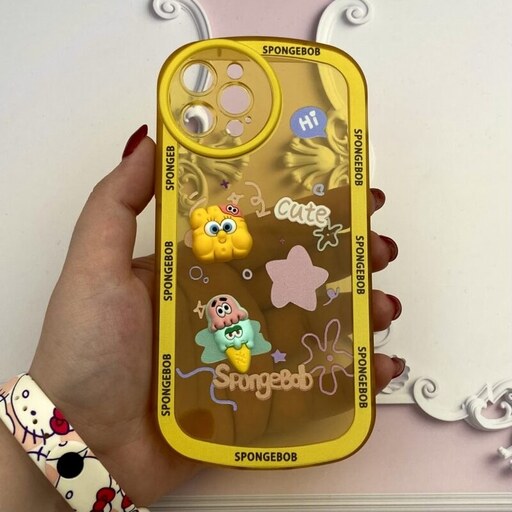قاب گوشی iPhone 12 Pro آیفون ژله ای شفاف بالشتی عروسکی برجسته سه بعدی محافظ لنز دار زرد کد 38155