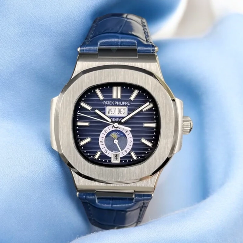 ساعت پتک فیلیپ ناتیلوس تقویم سالانه نقره ای استیل صفحه مشکی بند چرمی patek philippe nautilus