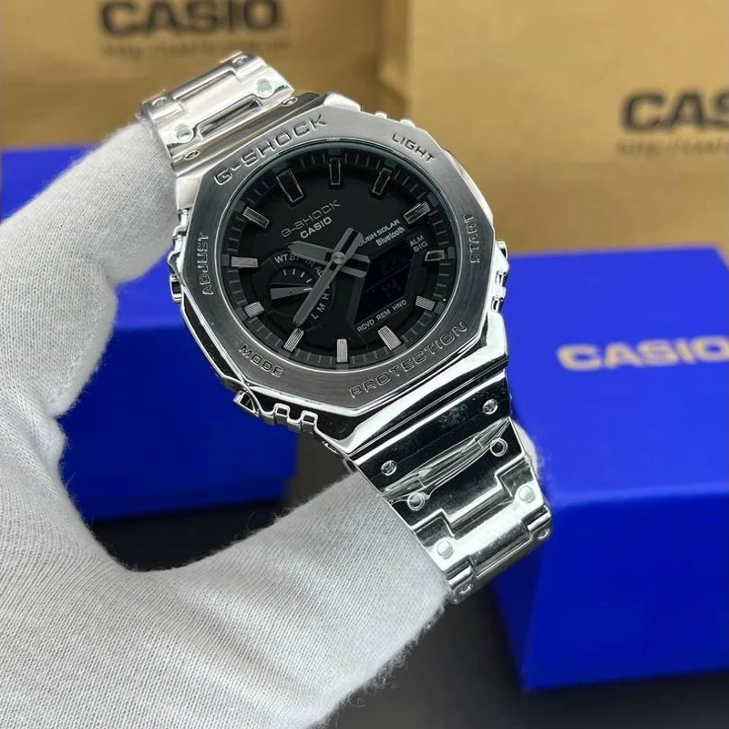 ساعت مچی کاسیو جی شاک مدل GM-B2100D-1ADR بند فلزی (جیشاک GShock) تنظیم اتوماتیک با پایتخت کشورها،اتولایت