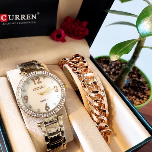 ست زنانه زیبا  ساعت استیل مارک کیناو نگین دار به همراه دستبند ژوپینگ  به همراه جعبه کادویی 