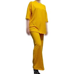 ست تیشرت و شلوار زنانه قوارده دار نایک رنگ زرد مناسب سایز 40 تا 48 جنس ترکیبی از پنبه و ویسکوز و لاکرا