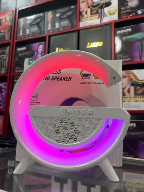 اسپیکر بلوتوث دار و وایرلس دار دارای شارژر دهی بدون سیم موبایل و ساعت دارای 2 عدد بلندگو همراه با نور LED دارای نور