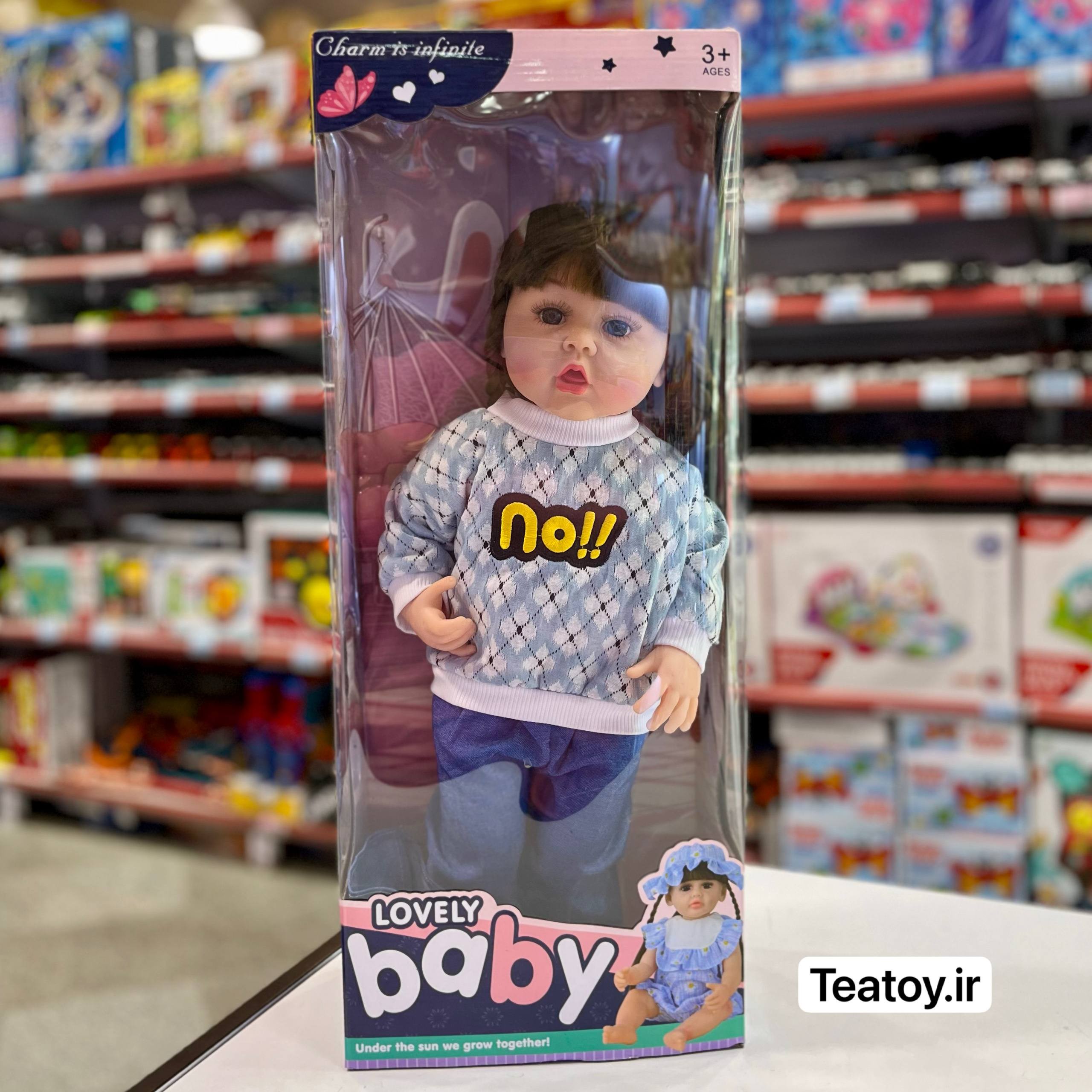 عروسک سلیکونی سنسوری 50 سانتی با لباس آبی، شلوار طرح جین و کلاه مو بلند