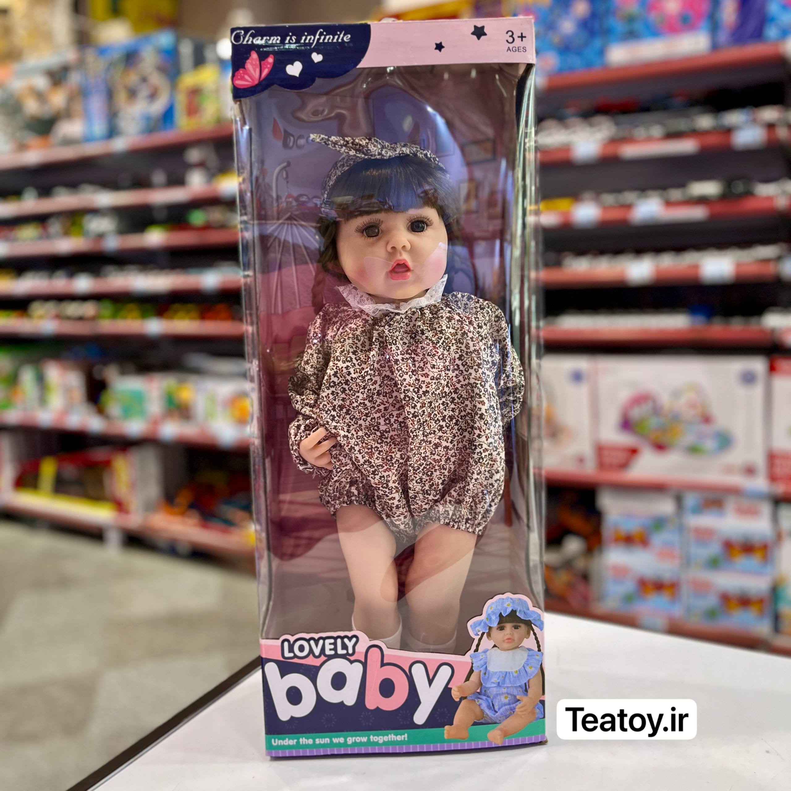 عروسک سلیکونی سنسوری 50 سانتی جعبهای با لباس گلریز قهوهای