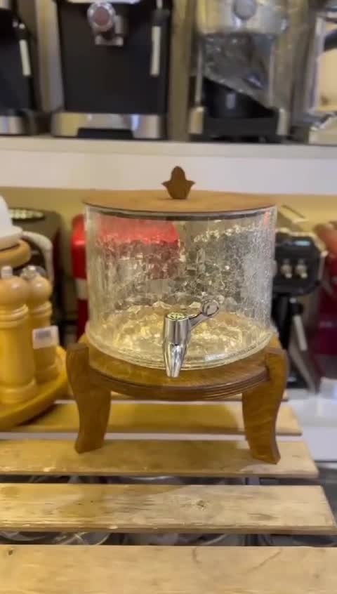 کلمن آبگز استوانه ای کلمن شیشه ای  پایه چوبی کلمن شربت خوری کلمن پذیرایی پایه چوبی کلمن آبمیوه پایه دار 