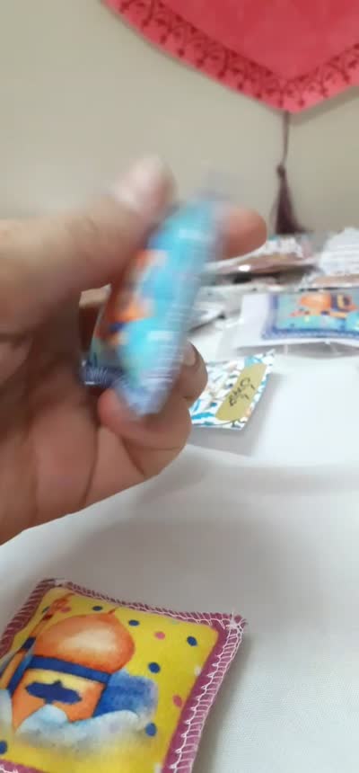 حرز امام جواد(ع)بالشتکی کودک با عکس پسرانه و دخترانه.شامل حرز امام جواد چاپی صغیر،آیه الکرسی و مقداری تربت داخل بالشتک