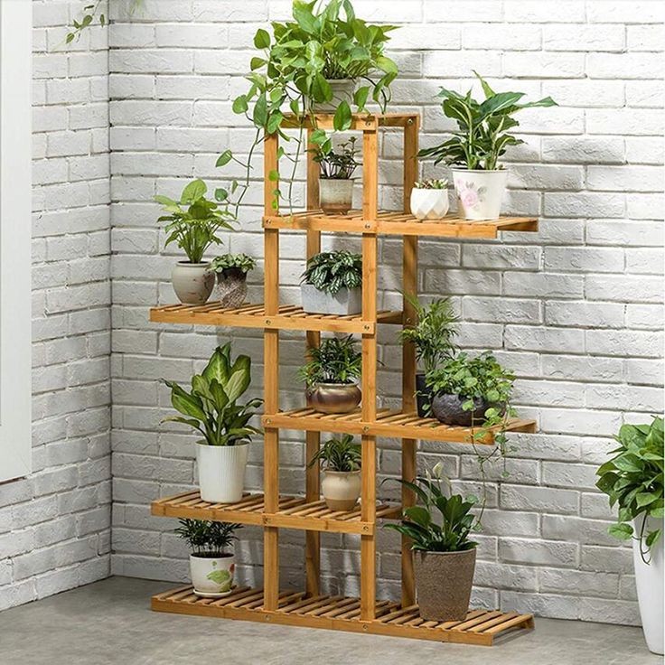 استند گلدان چوبی مدل Mt012 با ابعاد 110x75x25 سانتیمتر، ساختار چندطبقه برای نگهداری انواع گلدان و فضای مناسب برای چید...