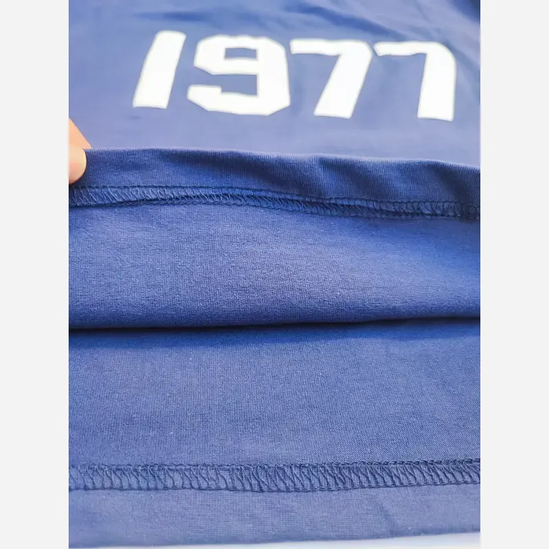 ست تیشرت و شلوارک اسپرت پسرانه و دخترانه طرح 1977 رنگ سرمه ای سایز 55 تا 75جدید