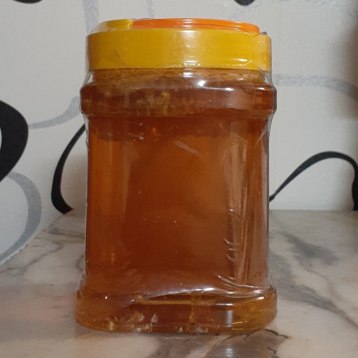 عسل چند گیاه با موم 1 کیلویی