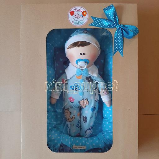 عروسک نوزاد همراه تشک و جعبه در رنگ های مختلف و جنسیت متفاوت