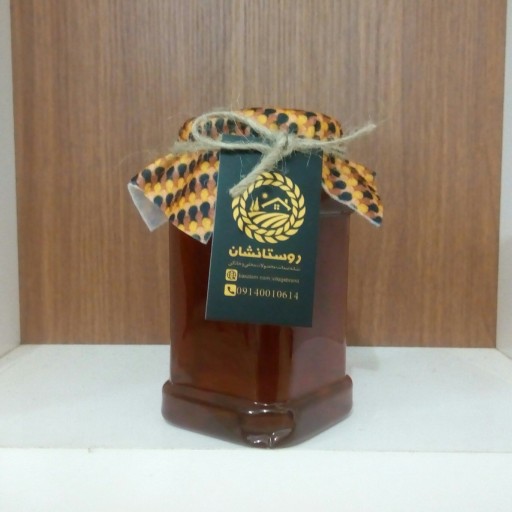 عسل طبیعی کنار یک کیلویی با برگه آزمایش