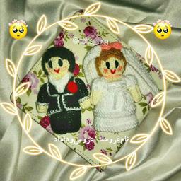 جاسوئیچی و آویز بافتنی عروس و داماد بافته شده با دومیل و کاموا مناسب