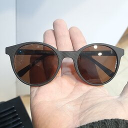 عینک آفتابی اسپرت گرد عدسی پلاریزد و uy400 همراه  با جلد و دستمال عینک 