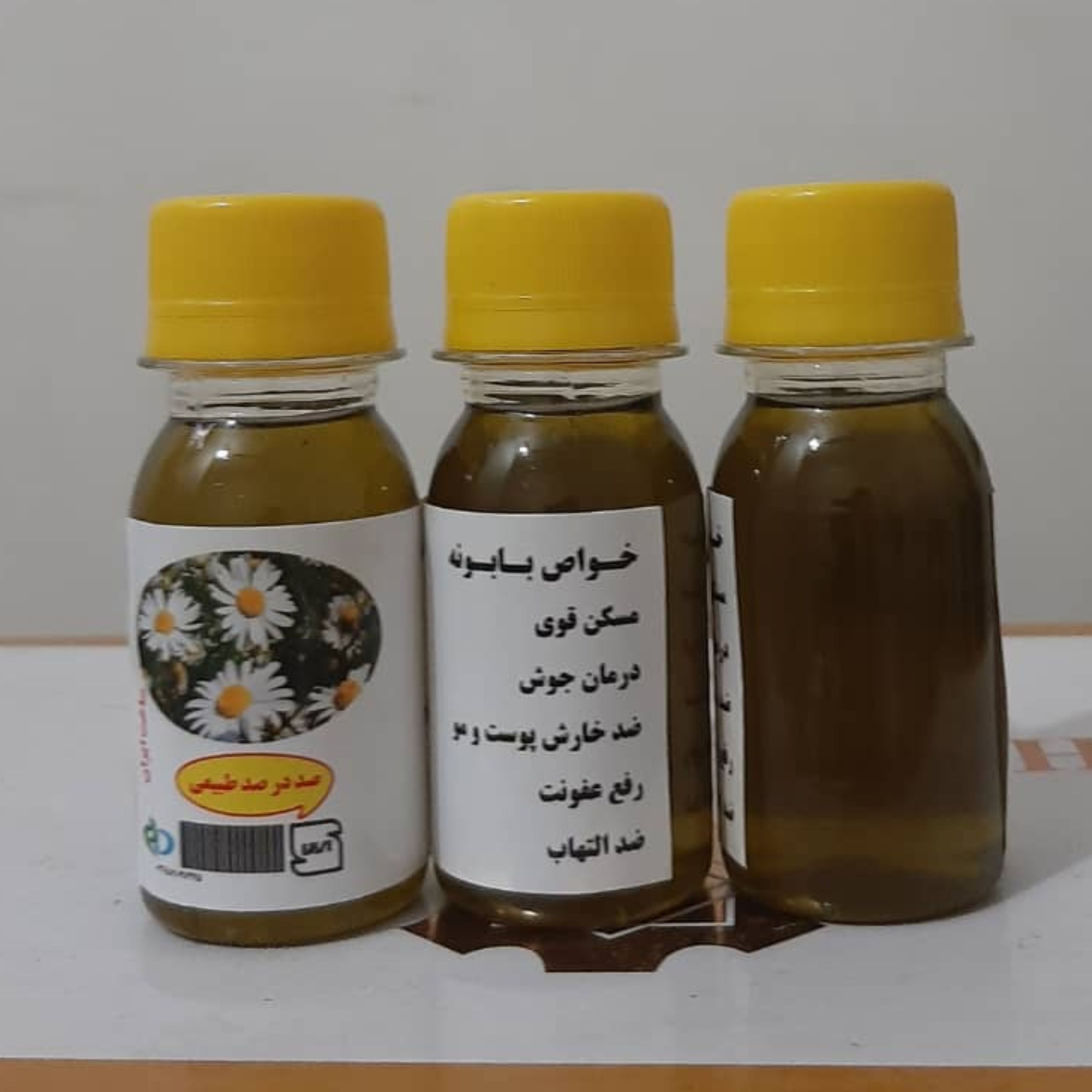 روغن بابونه 60 سی سی(روشن کننده رنگ مو نرم کننده مو جوش صورت شوره مو خشکی مو تقویت مو آبرسان مو آفتاب سوختگی آکنه اگزما)