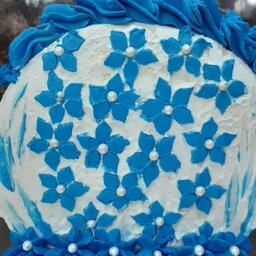 کیک تولد سر پا شکوفه های آبی 
