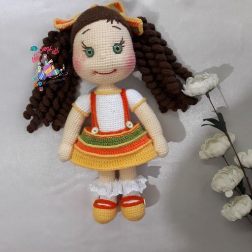 عروسک بافتنی دختر گل فروش کلبه ی باران هزینه ارسال به عهده ی مشتری میباشد