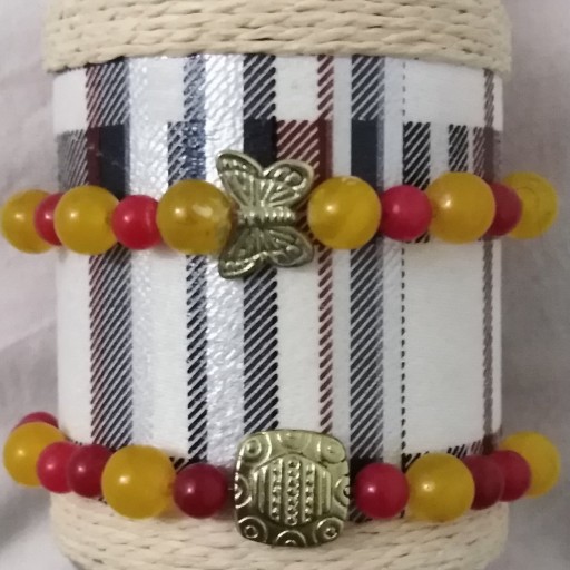 ست دستبند سنگ زرد و قرمز با خرجکار طلایی رنگ ثابت