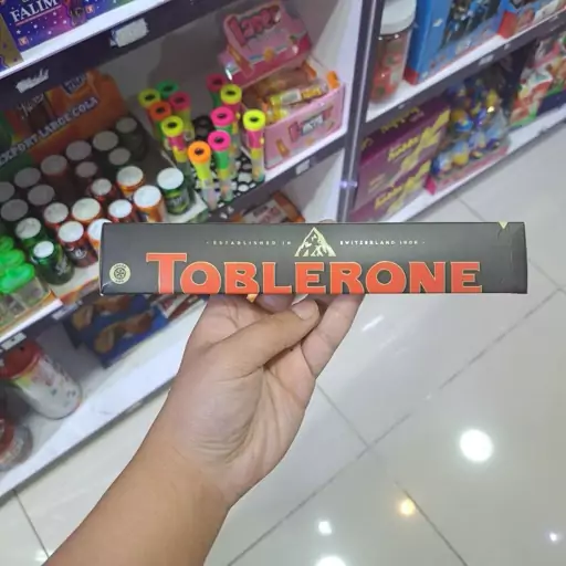 شکلات تابلرون تلخ با نوگات عسل و بادام تکی 100 گرمی  TOBLERONE