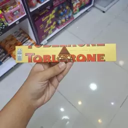 شکلات تابلرون بادام با نوگات عسل تکی 100 گرمی  TOBLERONE