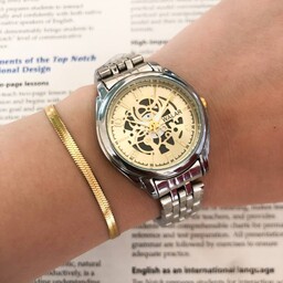ساعت والار زنانه طرح اتومات بنداستیل نقره ای همراه دستبند طلایی 