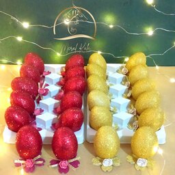 تخم مرغ های رنگی اکلیلی در رنگبندی های طلایی قرمز صورتی بنفش