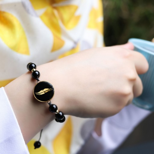 دستبند فریم دار طرح پر با پوشش طلا