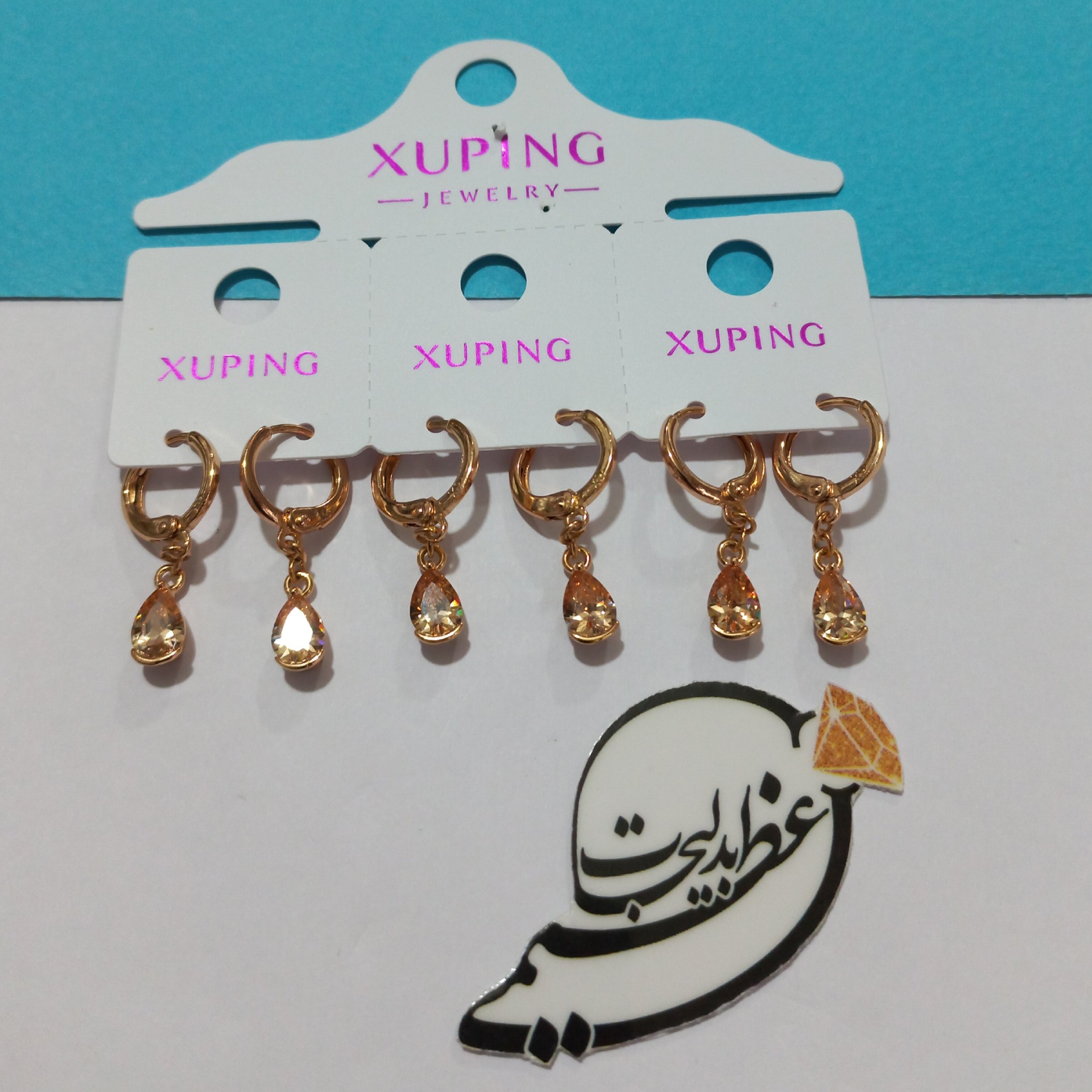 گوشواره حلقه ای برند ژوپینگ Xuping از جنس مس درجه یک و روکش طلا با آویز تک نگین ساده زرد 