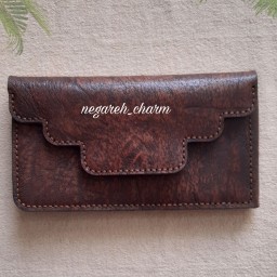 کیف پول دارای 9 جاکارتی و جای اسکناس ودسته چک طول 20عرض 10سبک وجادار