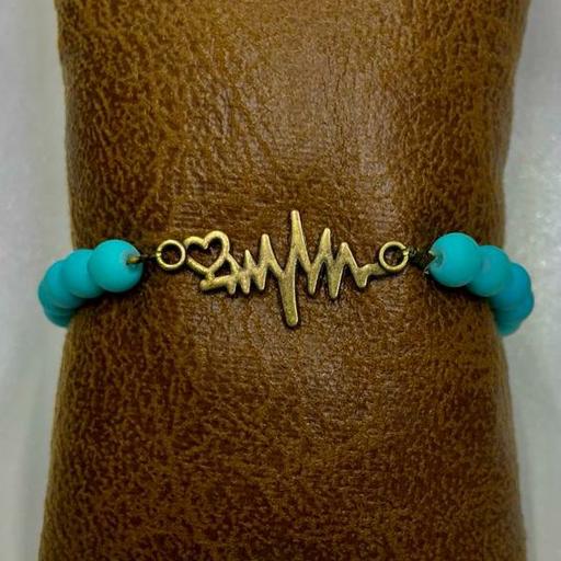 دستبند مدل کشی با مهره های ابی رنگ ثابت قابل شست و شو و خرج کار برنزی طرح ضربان قلب
