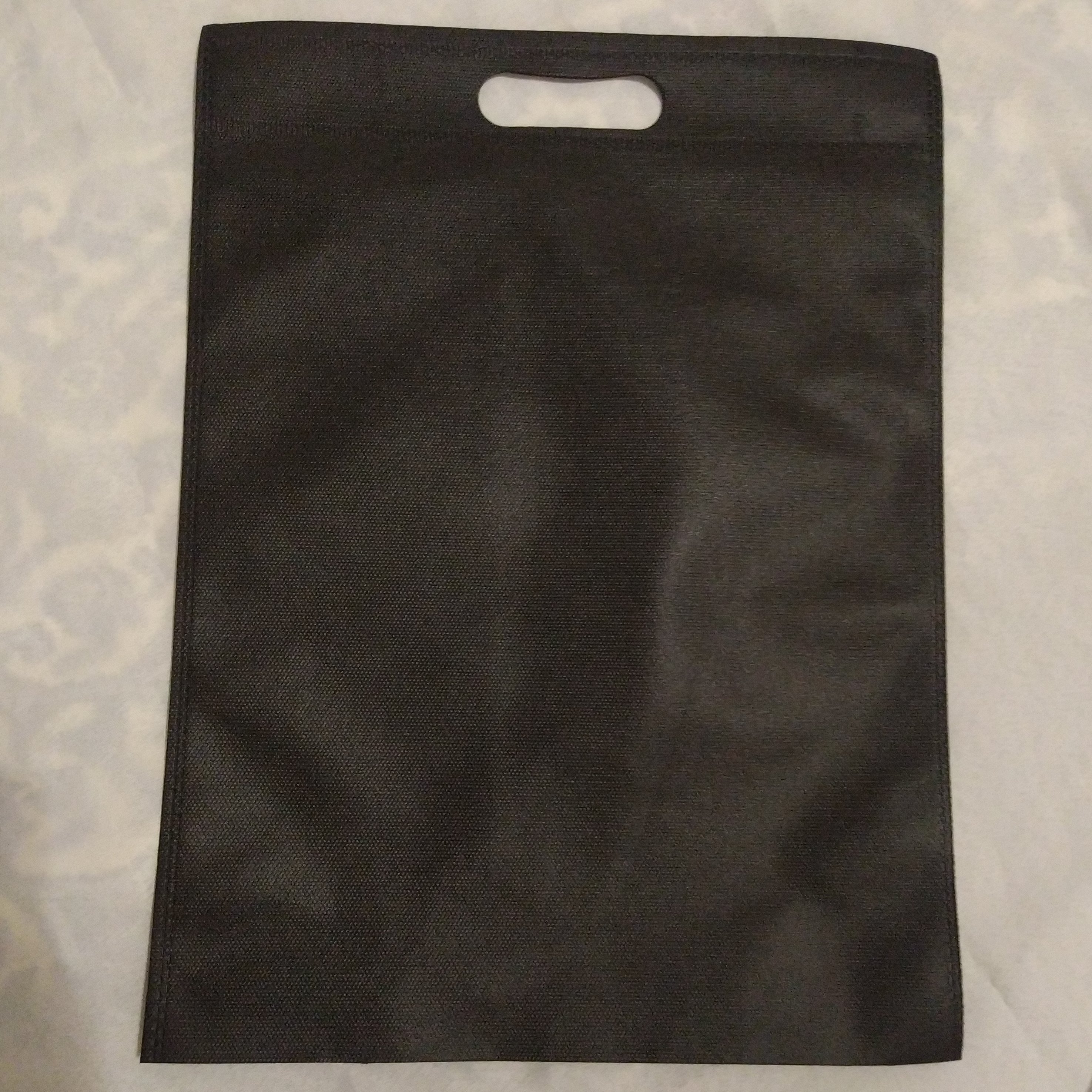 بسته 500 و 1000 عددی ساک دستی سوزنی 30-40 دسته پانچ  60 گرم 