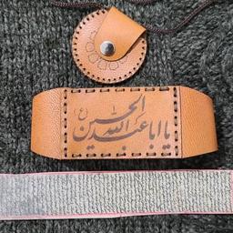 حرز اصلی امام جواد علیه السلام روی پوست آهو با بازوبند یا گردنبند بدون قاب نقره