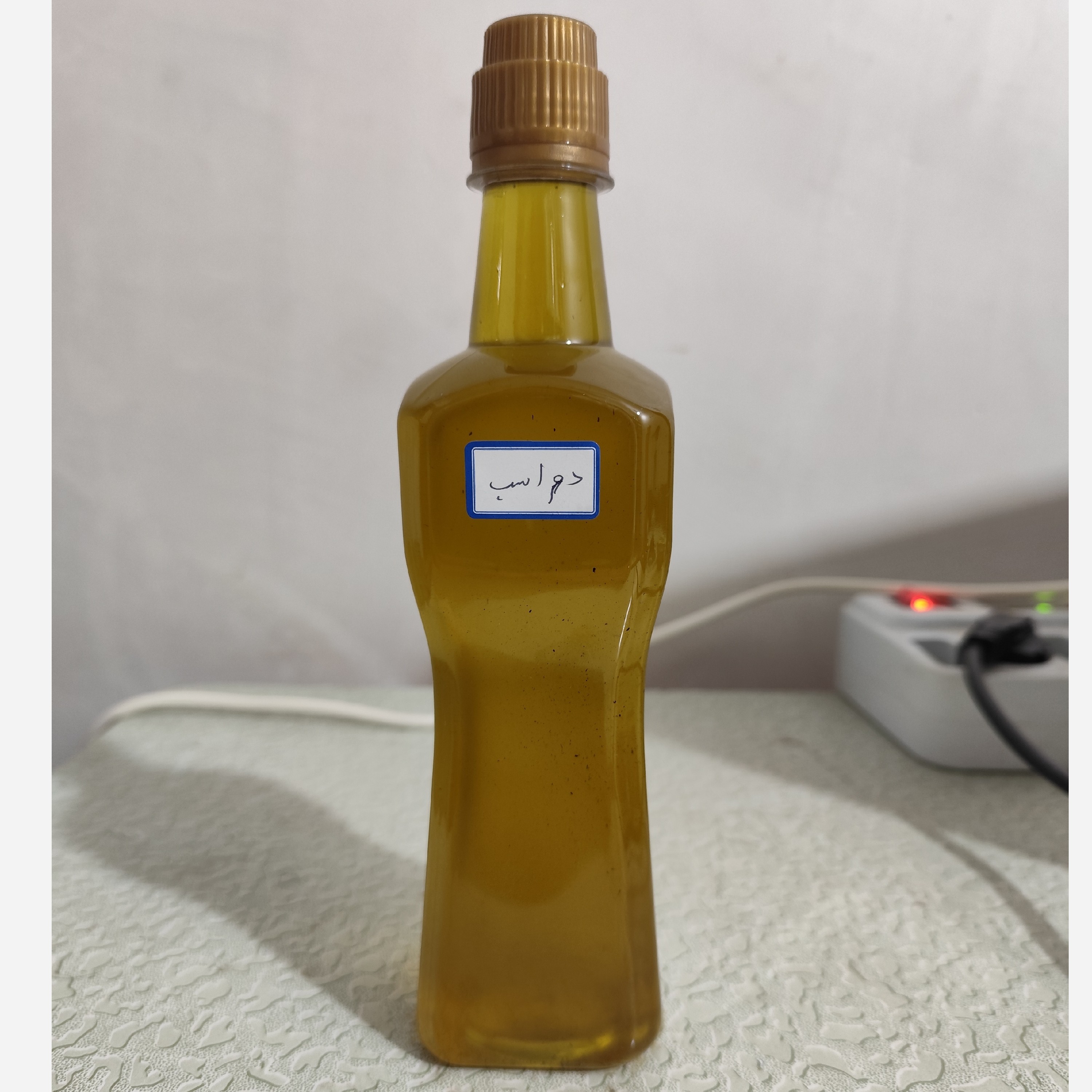 روغن دم اسب اصل عمده نیم لیتری (سیاه کننده مو-پرپشت کننده مو-پرپشت کننده ابرو و مژه-تقویت ناخن-رشد ناخن-سفت کننده ناخن)