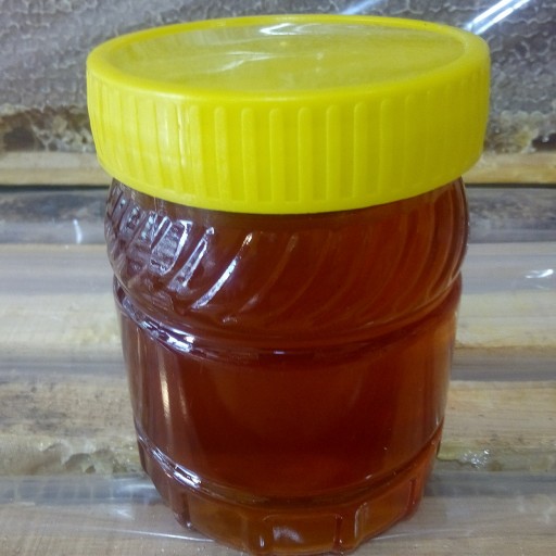 عسل 100درصد طبیعی چهل گیاه نیم کیلویی درصد ساکارز زیر 2 با برگه آزمایش.