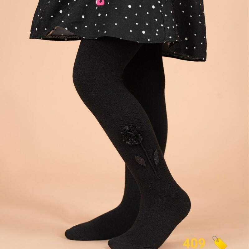 جوراب شلواری دخترانه رنگ مشکی ساده گل برجسته مناسب 1 تا 5 سال 